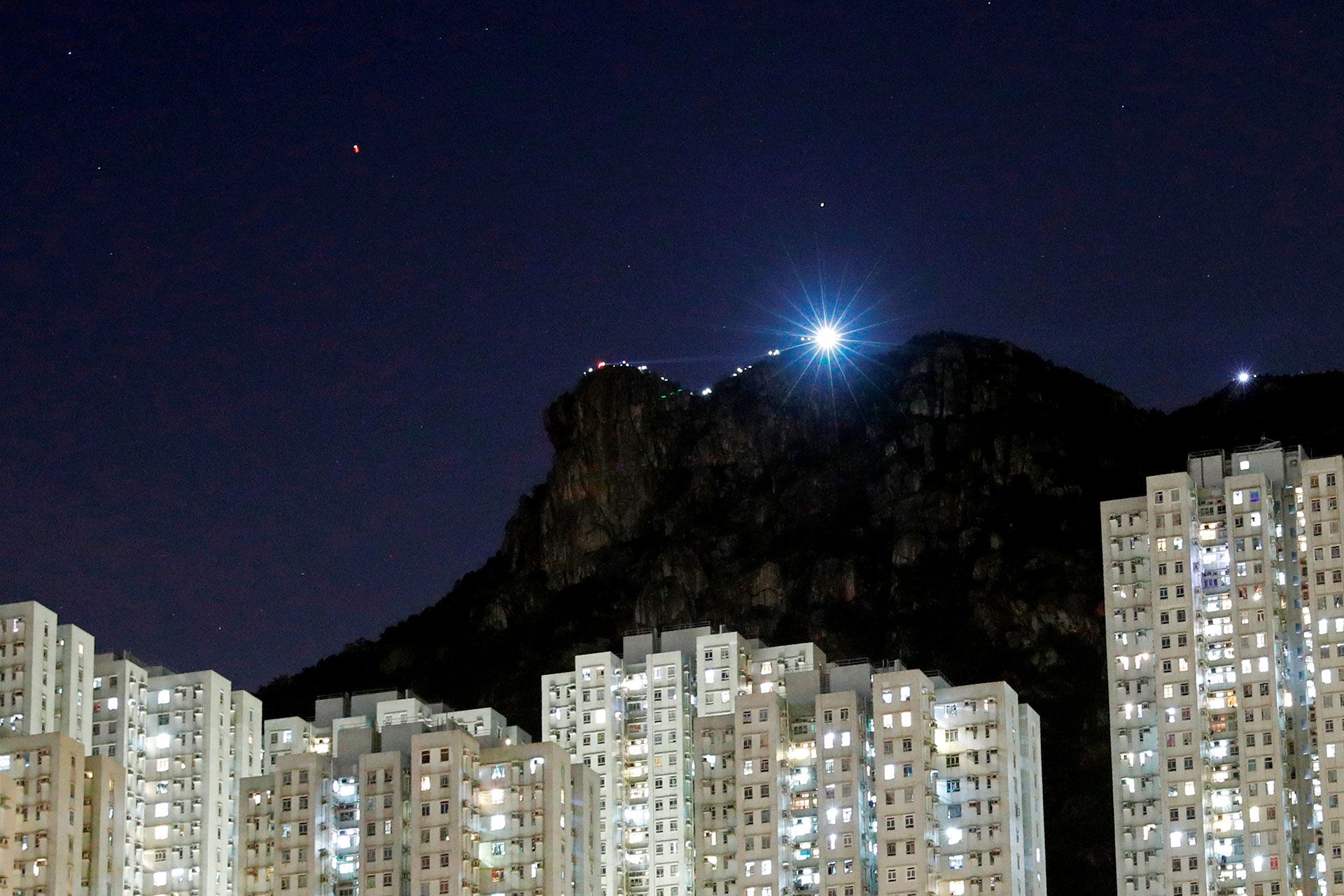  Below Lion Rock  By James Pomfret and Jessie Pang  Photography: Tyrone Siu, James Pomfret and Jessie Pang  Video: Andrew Jackson  Graphics: Aditi Bhandari  Photo editing: Kerk Chon  Design: Troy Dunkley  Edited by Kari Howard